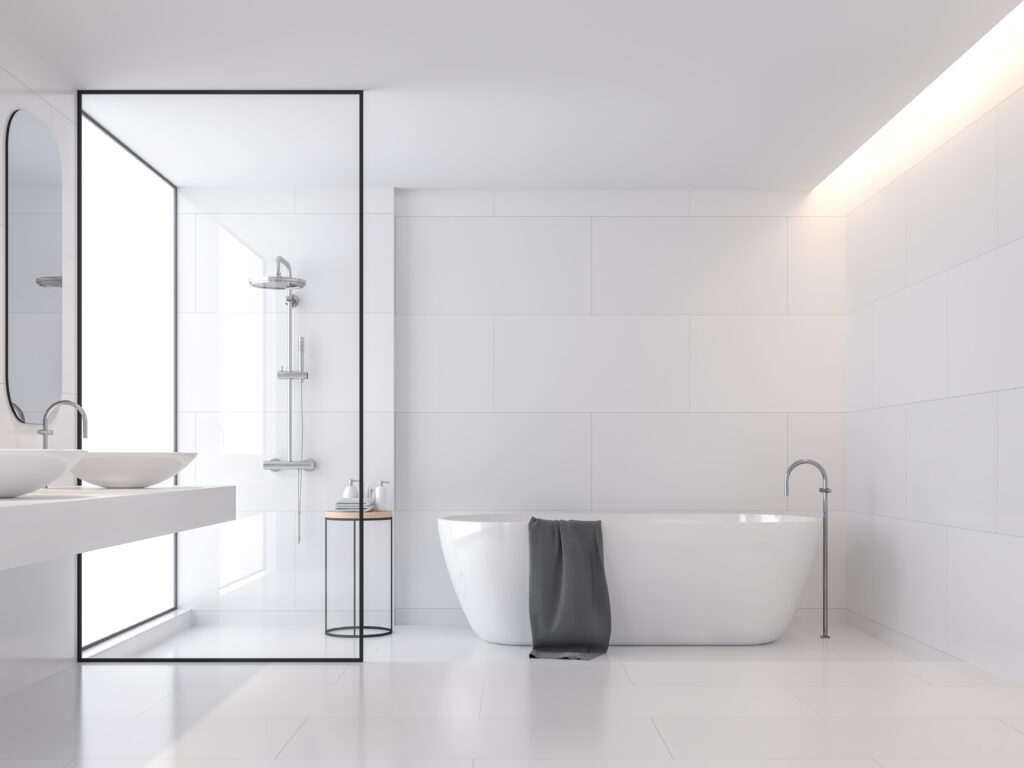 black framed shower door in white hotel bathroom