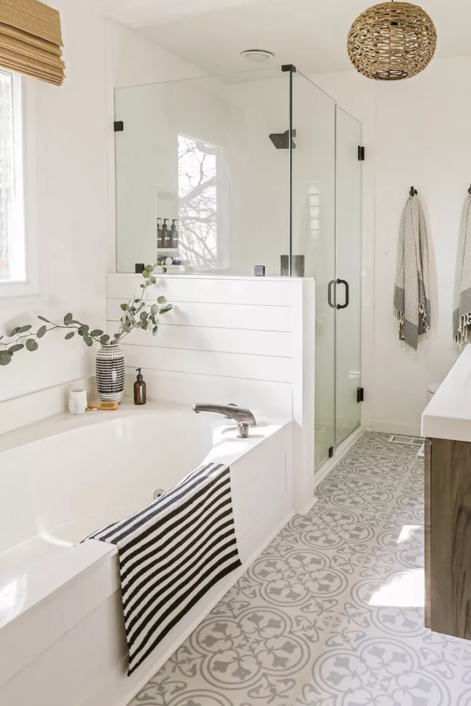 white bathroom with a frameless shower door