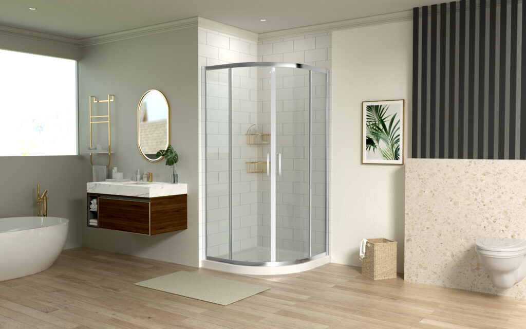 Curved quadrant shower enclosure with sliding doors installed in a compact bathroom corner