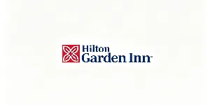 Hilton Garden Inn hotel logo with red square floral emblem and dark blue Hilton Garden Inn lettering