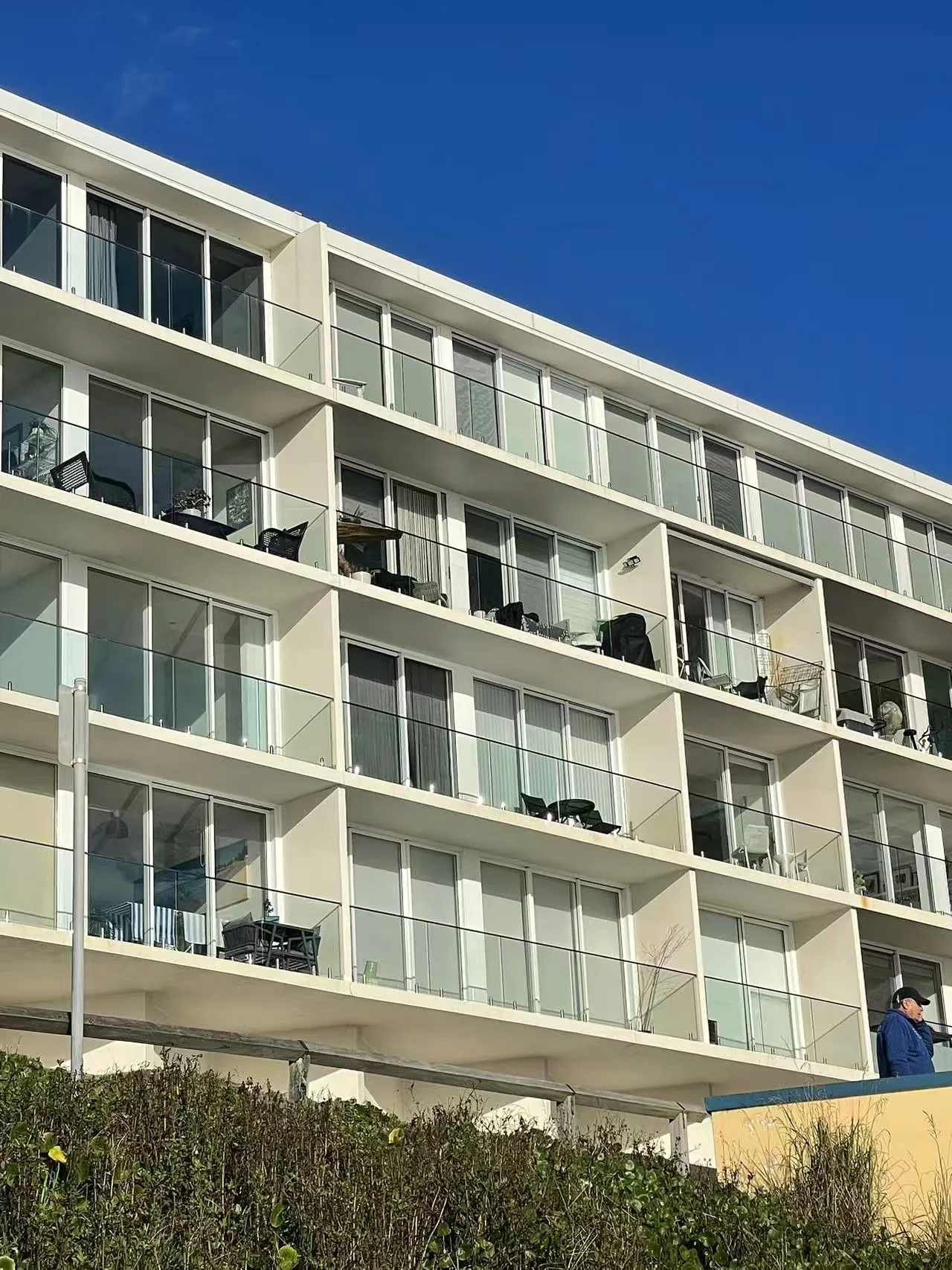 Waterview Beach Apartment in Dee Why, Australia — custom glass balcony balustrade system built for salt-spray coastal exposure