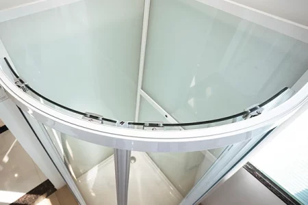 curved shower stall at the corner